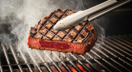 Juicy grilled steak with perfect grill marks lifted from a hot barbecue