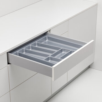 Spacious 60 cm kitchen drawer with plastic cutlery tray insert, ideal for organized utensil storage in modern cabinetry.