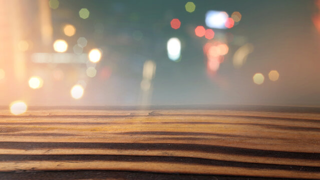 Rustic wooden table surface with colorful bokeh lights background. Mockup, template, or copy space. Product display and promotional content