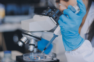 Portrait, science and happy woman on laptop in lab to research chemistry, test or innovation....