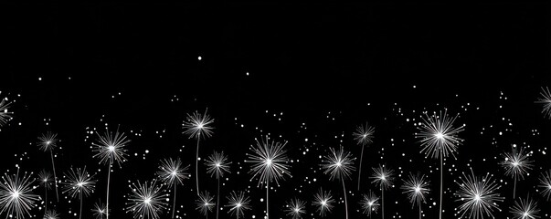 Bright fireworks explode against a dark night sky, lighting up the area with sparkling patterns.