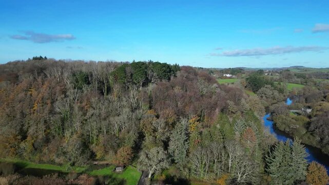 Totnes, Devon, England: DRONE VIEWS: The drone flies over the River Dart, woodland and countryside to reveal distant views of Dartmoor. South Devon is a popular UK holiday destination (Clip 2 of 2).