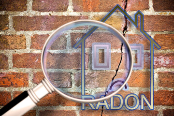 The danger of radon gas in our homes - concept image with an outline of a small house seen through a magnifying glass