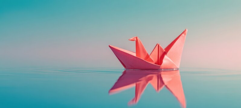 The Origami Crane Floating on Calm Reflective Pastel Water with Soft Sunrise Glow