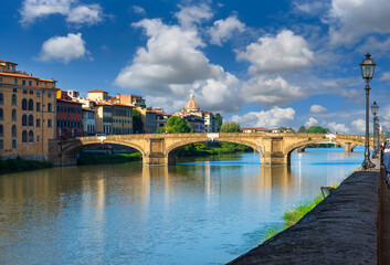 View of Arno river, embankment of Oltrarno quarter and Ponte Santa Trinita in Florence, Italy. Architecture and landmark of Florence. Cityscape of Florence