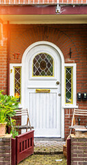 typical century Dutch door holland view in a fortified town with brick houses and front flower...