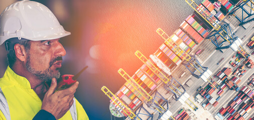 Engineer working in Modern Logistics,transportation of Container Cargo ship,Cargo plane, crane bridge in shipyard. Distribution container terminal on international logistics, import-export background.