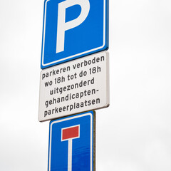 Bicycle path with dead end road sign with bicycle exception. Environment is a Dutch or Frisian landscape
