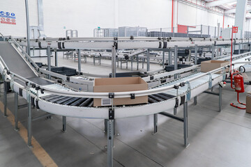 packing line in a logistics warehouse. conveyor belt in a modern production line