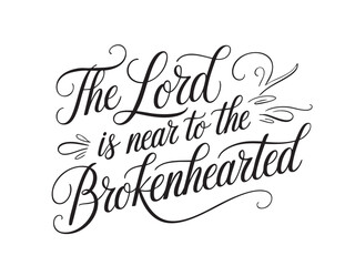A decorative hand-lettered design featuring the inspirational religious phrase The Lord is near to the brokenhearted