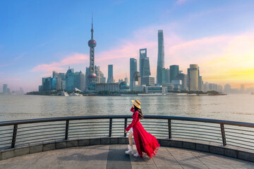 Tourists sightseeing on The Bund and Lujiazui of Shanghai, China.