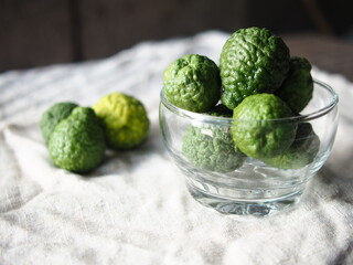 kaffir lime friut on nature fabric background 