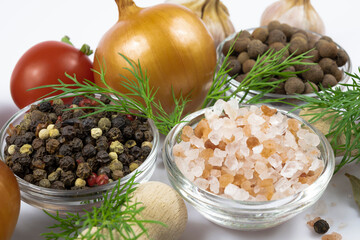 Vegetables and spices close-up on a white background.