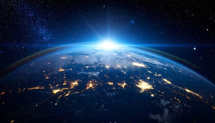 Earth from space with city lights and sunrise glow.