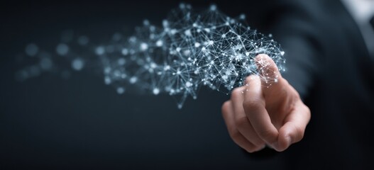 Finger touching glowing digital network structure against dark background