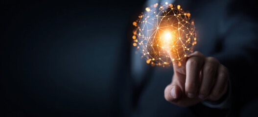 Finger touching glowing digital network sphere against dark background