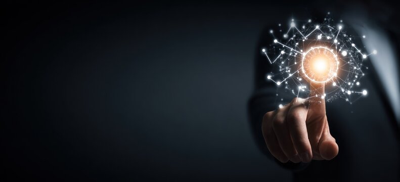 Finger touching glowing digital network interface against dark background.