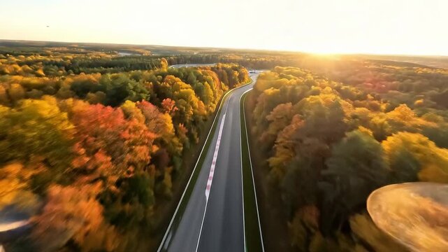 Experience the thrill of autumn racing with this dynamic aerial view of a track winding through vibrant fall foliage