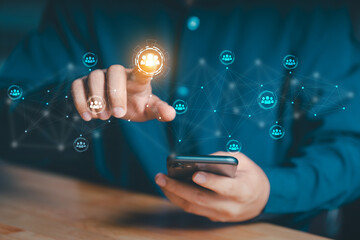 Holographic display of interconnected user icons, symbolizing social networking or team collaboration. Represents the integration of mobile technology with digital connectivity and human resources