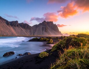 Naklejka premium Dramatic Icelandic Landscape - Vestrahorn Mountain at Sunrise with Black Sand Beach.