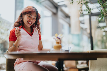 A woman in a pink vest and red blouse sits at a cafe table, jotting notes with a pen amid flowers. Bright, welcoming atmosphere conveys hospitality, casual business, and everyday moments for branding.