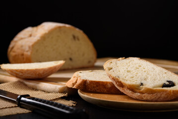 Freshly baked sourdough bread   on a black background