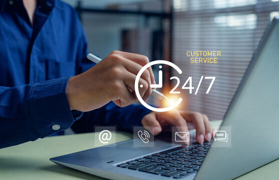 professional worker using a laptop with 24-7 customer service icons, illustrating online support, digital communication, and real-time assistance for businesses and clients.