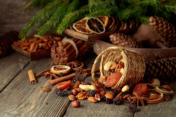 Dried fruits and nuts on an old wooden table.
