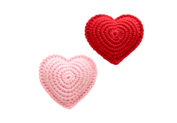 Crocheted pink and light pink heart-shaped decorative pillows, isolated on a transparent background