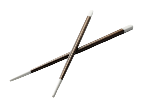 Two crossed magic wands with white tips on black background