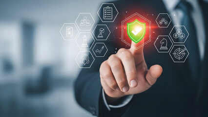 Businessman activating digital shield for cyber security and data protection