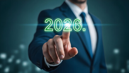 Businessman touching 2026 hologram display forecasting future trends and business strategy