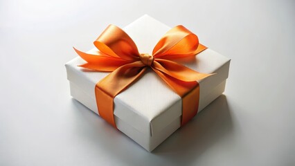Fototapeta premium A beautifully wrapped white gift box with an orange ribbon tied in a elegant knot