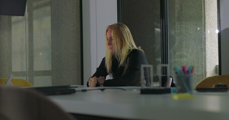 Frustrated businesswoman slams hand on conference table in anger, overwhelmed during workplace...
