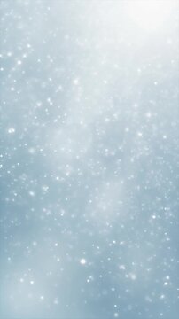 Displays a blurry view of light snow falling in winter, suitable for winterthemed backgrounds, seasonal social media posts, and holiday designs.