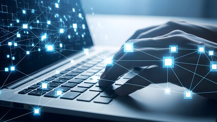Hands typing on laptop with digital network overlay