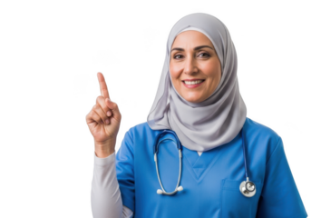 Smiling muslim nurse in blue scrubs pointing up isolated on transparent background