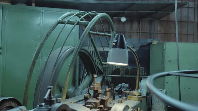 industrial machinery with rotating components, oldfashioned workshop with spinning belts and gears . Media