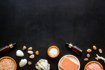 Naklejka na ściany i meble Essential oil and spa cosmetic products with sea shells, top view. Beauty spa therapy cosmetics and wellness background