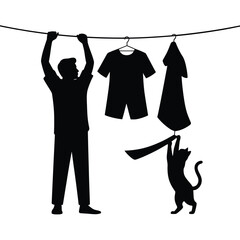 Silhouette of a man hanging laundry with a playful cat