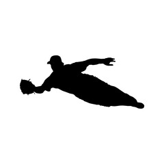 Silhouette of baseball player diving to catch the ball in game