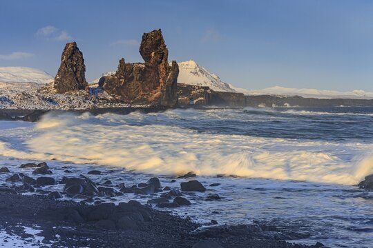 Rocks and surf on the coast, evening light, sun, snow, winter, Arnarstapi, Snaefellsnes, Vesturland, Iceland