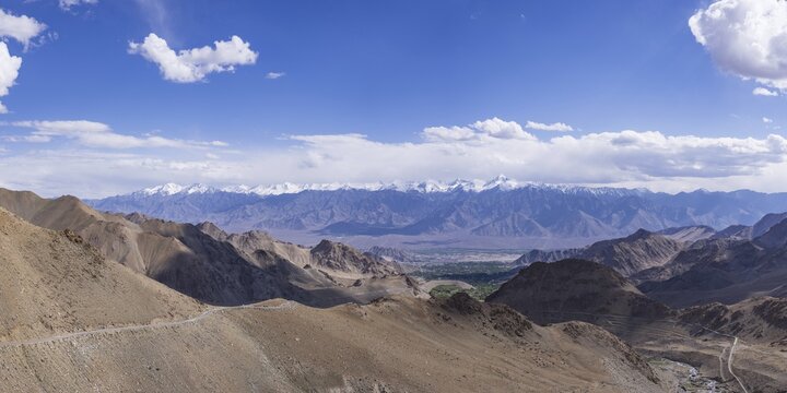 Panorama from the Khardong Pass, the second highest motorway pass in the world, over Leh and the Indus Valley to Stok Kangri, 6153m, Ladakh, Jammu and Kashmir, India