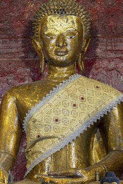 Golden Buddha statue, Bhumispara-mudra, Buddha Gautama at the moment of enlightenment, Wat Long Koon, Luang Prabang, Laos