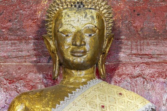 Golden Buddha statue, Bhumispara-mudra, Buddha Gautama at the moment of enlightenment, Wat Long Koon, Luang Prabang, Laos