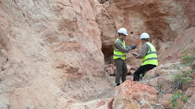 Geologist surveying mine,Explorers collect soil samples to look for minerals, A geologist is a scientist who studies the Earth's physical structure and substances