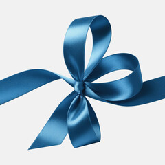 Close up of a shiny blue satin ribbon bow isolated on white