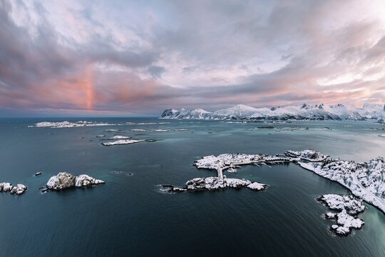 Snow-covered mountains by the fjord and islands, Bergsfjorden, Hamm i Senja, Senja Island, Norway