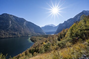 View of the Königssee from the Rinnkendlsteig mountain hiking trail, autumnal forest and snow-covered mountains, Sonnenstern, Berchtesgaden National Park, Berchtesgadener Land, Upper Bavaria, Bavaria, Germany
