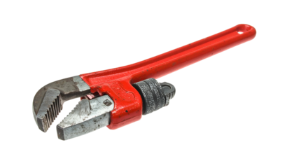 Red pipe wrench shows wear and tear against black background